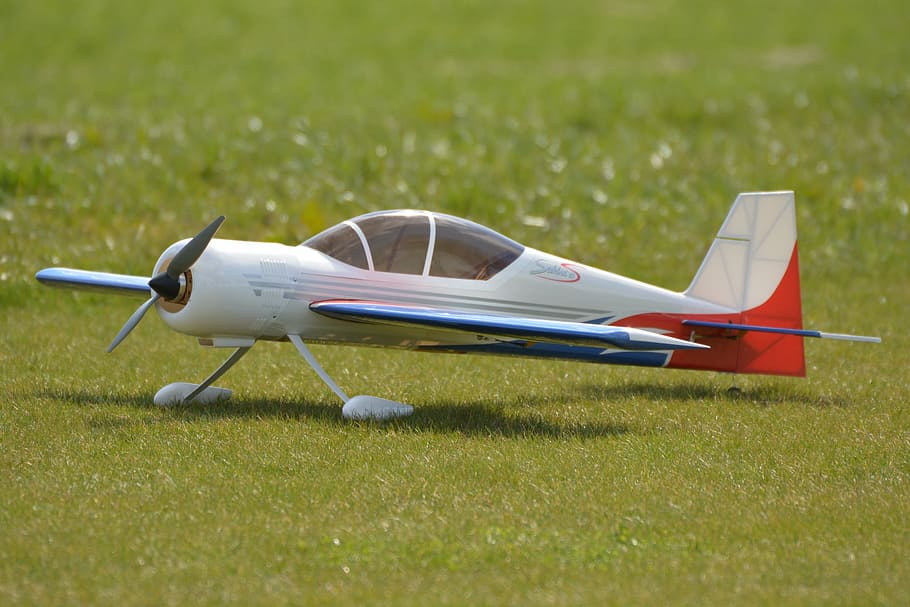 white, red, airplane toy, grass, plane, modelling aircraft, model airplane, airplane, air Vehicle, flying