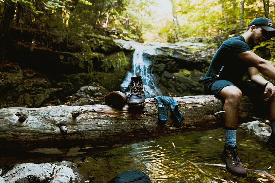 man, sitting, brown, tree trunk, creek, nature, woods, forest, stream, water