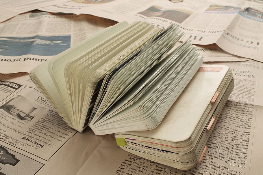 paper, book, open book, notes, stack, newspaper, large group of objects, business, indoors, publication