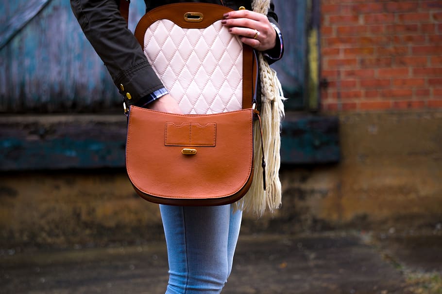 woman, putting, hands, inside, brown, leather sling bag, people, fashion, bag, manicure