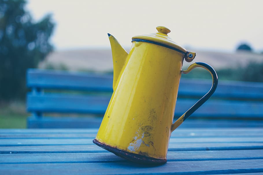 table, bench, yellow, kettle, thermos, blur, focus on foreground, close-up, food and drink, still life