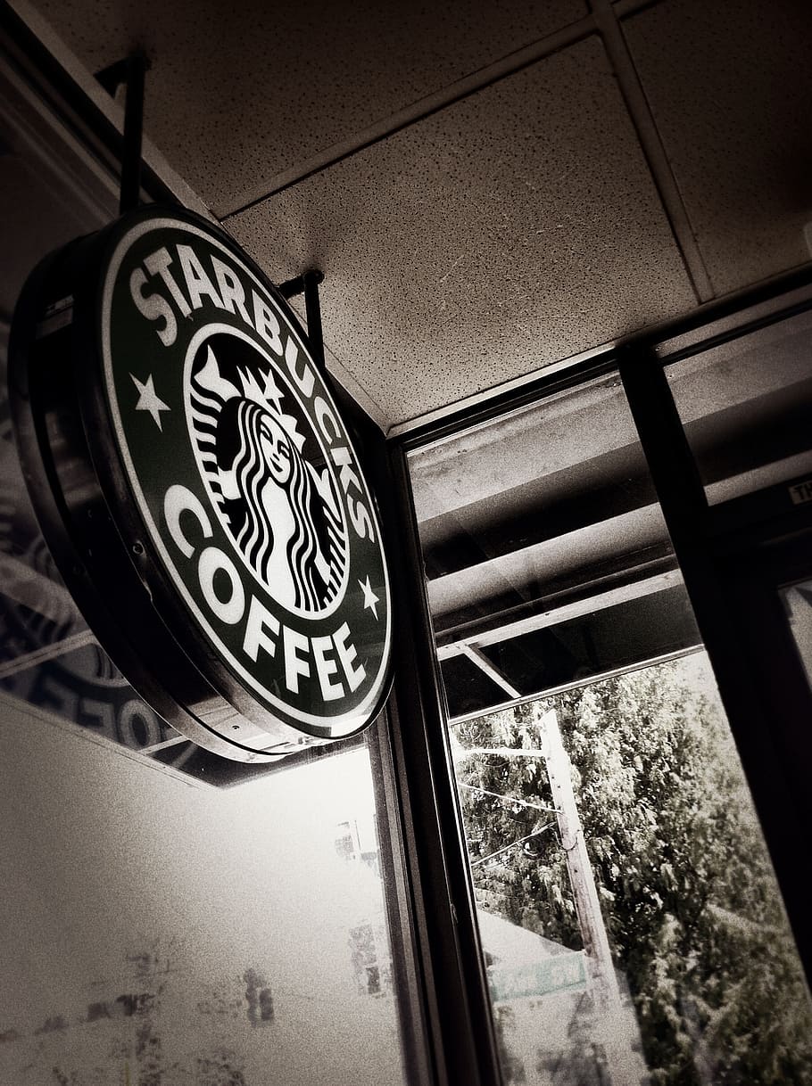 starbucks coffee signage, starbucks, mood, coffee, logo, entrance, cafe, text, transportation, mode of transportation