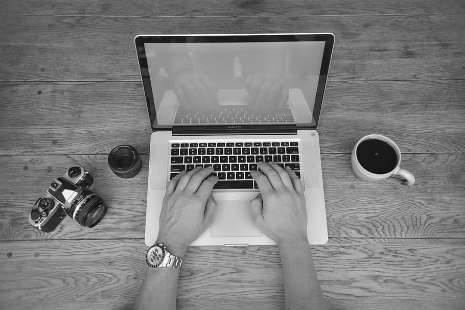 grayscale photo, person, hands typing, black, white, laptop, work, place, notebook, macbook