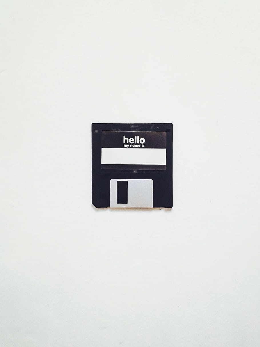 floppy disk, disk, vintage, retro, communication, western script, text, indoors, white background, studio shot