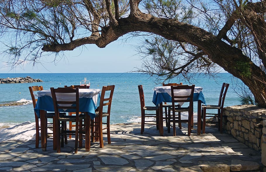 crete, panormos, tavern, table, chairs, vote, water, tree, sea, seat
