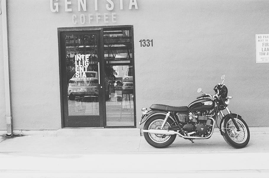 grayscale photo, motorcycle park, outside, coffee shop, black, motorcycle, near, genisia, coffee, shop