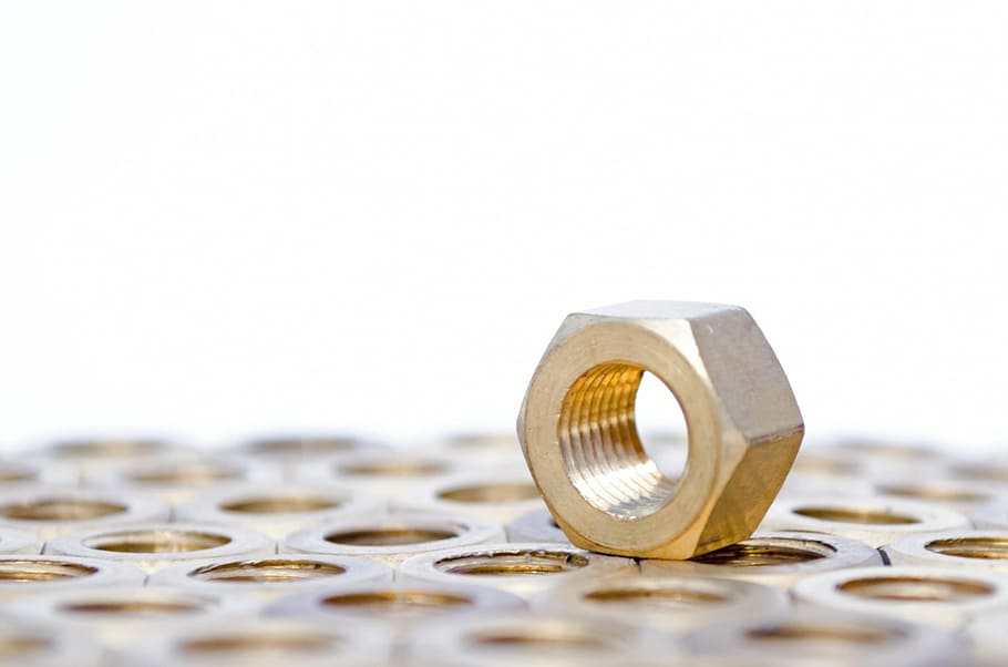 gold-colored metal hex nut, nut, metallic, metal, white, tool, head, screw, background, isolated