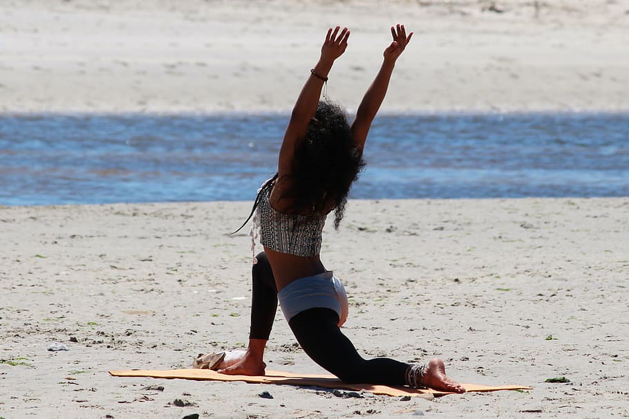 woman, wearing, gray, top, kneeling, brown, sand, daytime, yoga, beach
