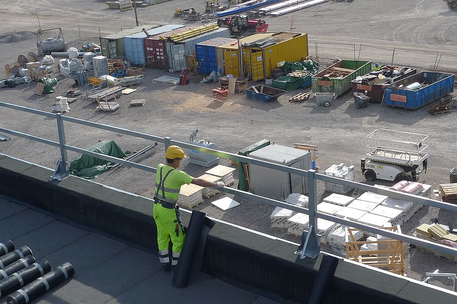 man, standing, railing, worker, industry, roof, view, work, hard hat, goods