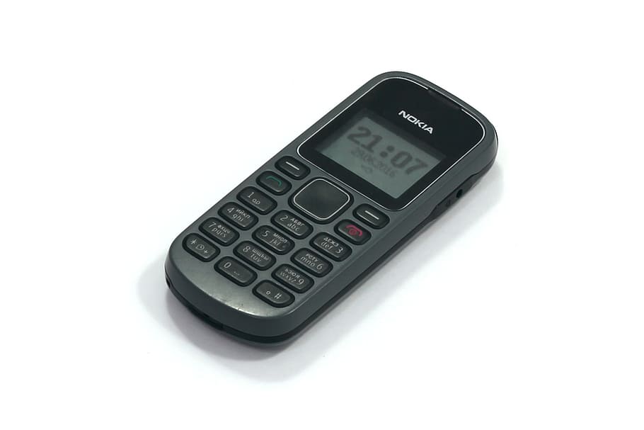 turned-on, black, nokia 1280 candybar phone, nokia 1280, cell phone, mobile, old model, number, white background, technology
