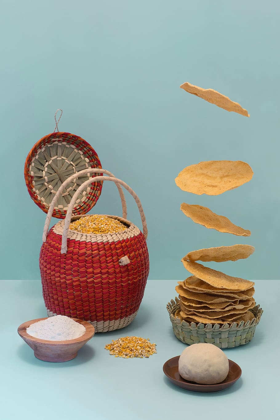 wicker round, red, gray, basket, teal surface, brown, bowl, chips, wicker, top