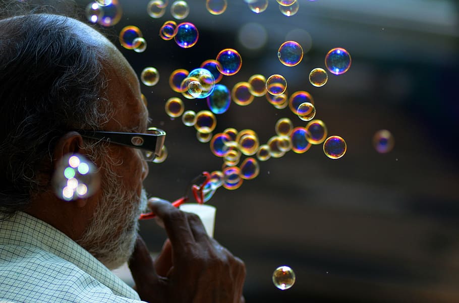 man blowing bubbles, bubbles, colors, life, bubble, blowing, soap Sud, outdoors, bubble Wand, fun