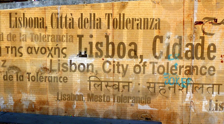 lisbon, shield, city of tolerance, text, communication, western script, business, indoors, architecture, choice