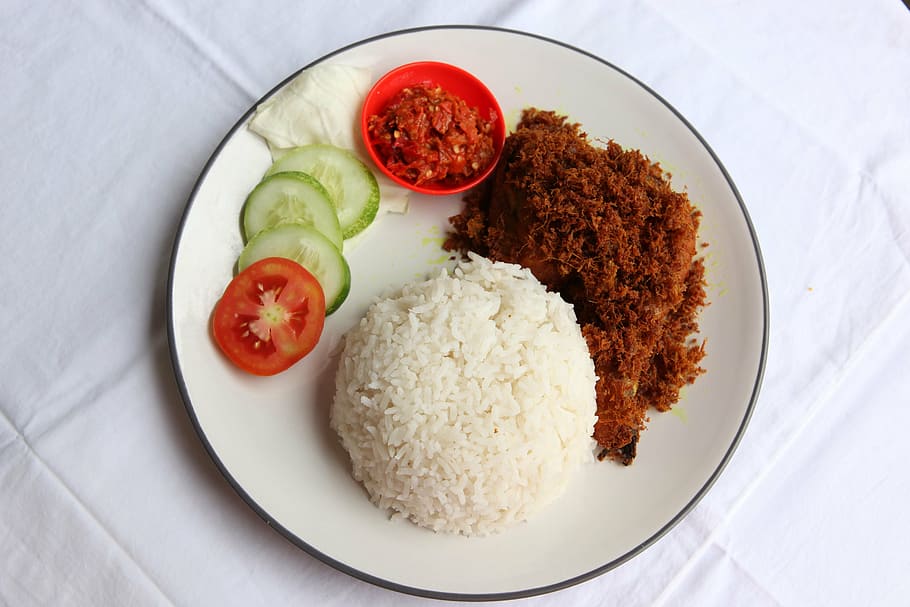 steamed, rice, ground meat dish, tomato, cucumber slices, plate, nasi, ayam, penyet, food