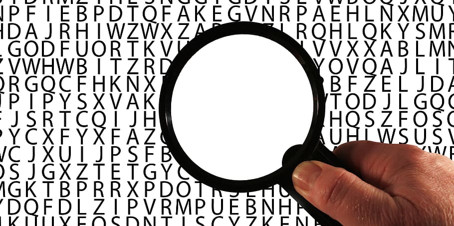 person holding magnifier, alzheimer's, dementia, words, word-finding disorders, memory, language, think, thinking assets, recognize