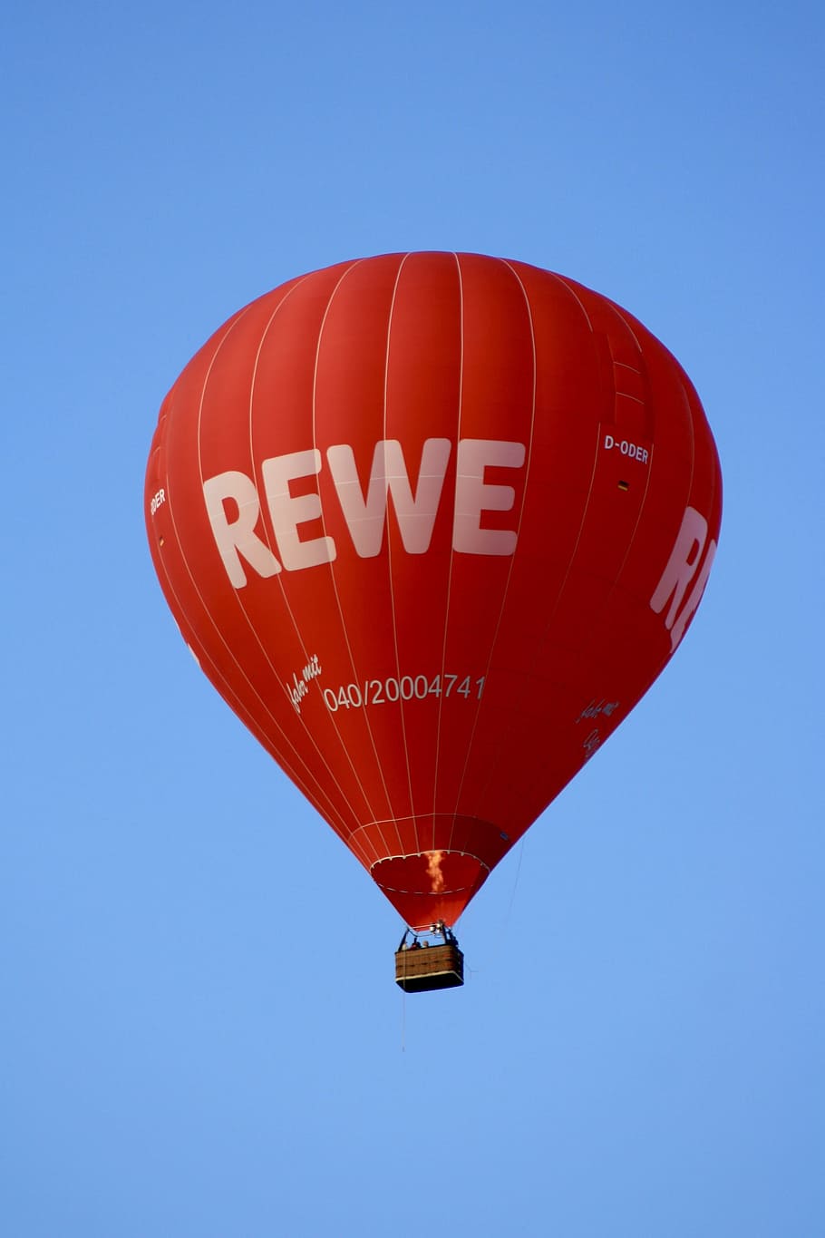 balloon, sky, hot air balloon rides, hot air balloon, red, rewe, blue, clear sky, air vehicle, mid-air