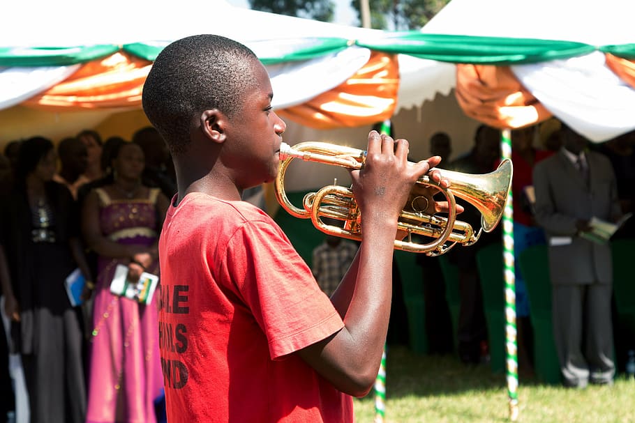 boy playing trombone, people of uganda, children of uganda, africa, uganda, mbale, trumpets, music, celebration, band