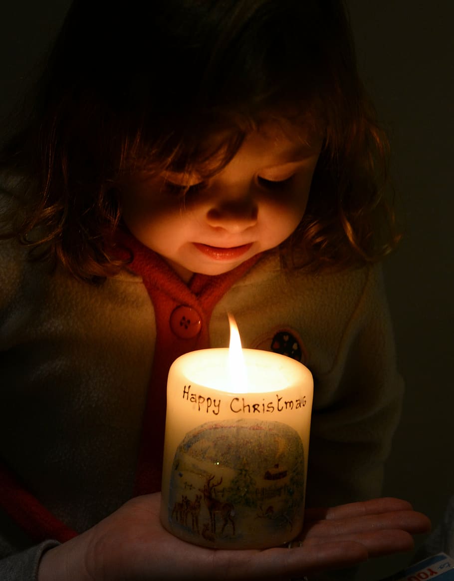 girl, facing, lit, pillar candle, christmas, candle, glow, little girl, child, childhood