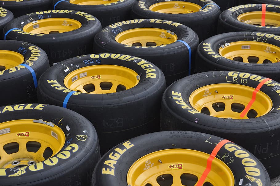 close-up photography, yellow, multi-spoke vehicle wheel, goodyear tire lot, nascar, brad, keslowski, tires, racing, wheel