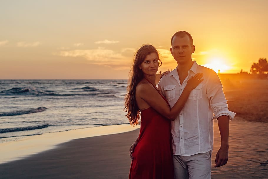 man, woman, standing, beachside, a couple of, young couple, love, holiday, sunset, beach