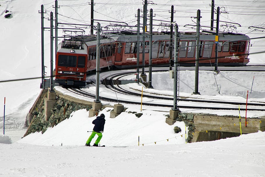 man skiing, train, snowy, field, daytime, skier, rails, pull station, zermatt, gornergrat
