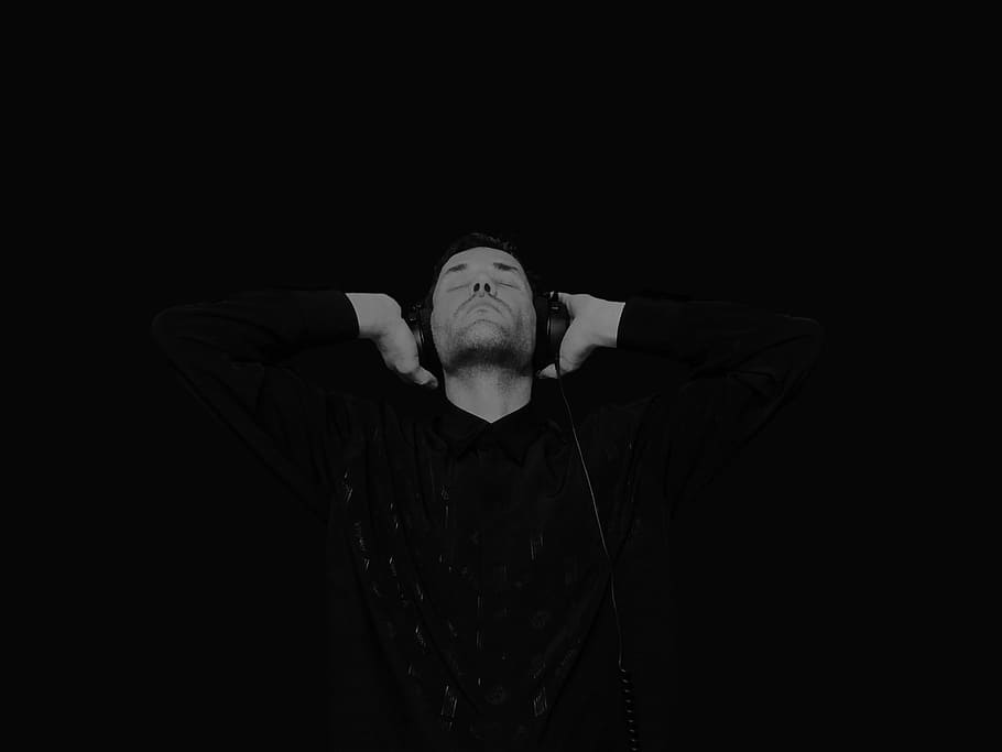 grayscale photo, man, wearing, long-sleeved, collared, shirt, corded, headphones, music, sound
