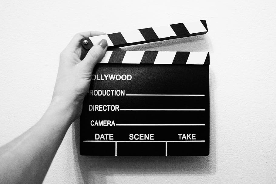 gray-scale photo, person, holding, director, cut, board, direction, film, ciack, scenes