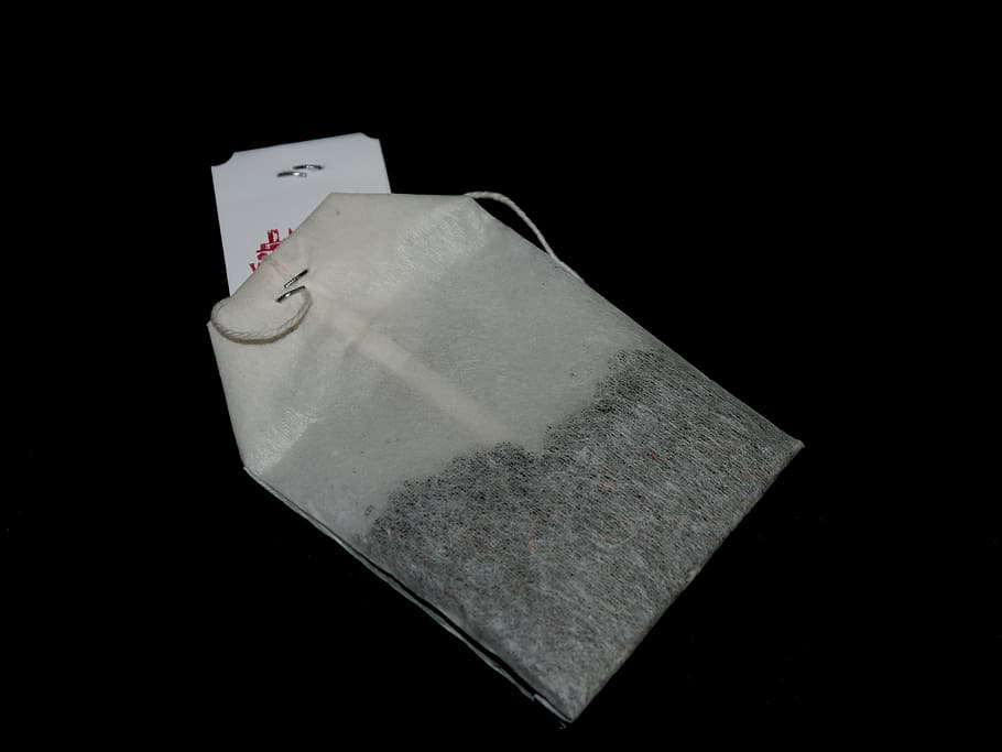 tee, tea bags, white, black background, studio shot, indoors, copy space, close-up, still life, high angle view