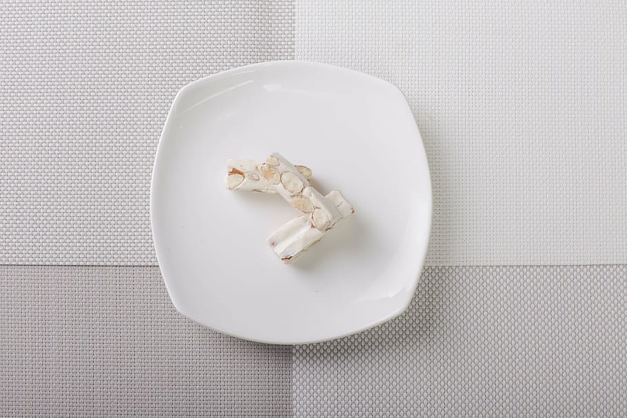 nougat, almond, dish, dim sum, indoors, directly above, white color, food and drink, studio shot, still life