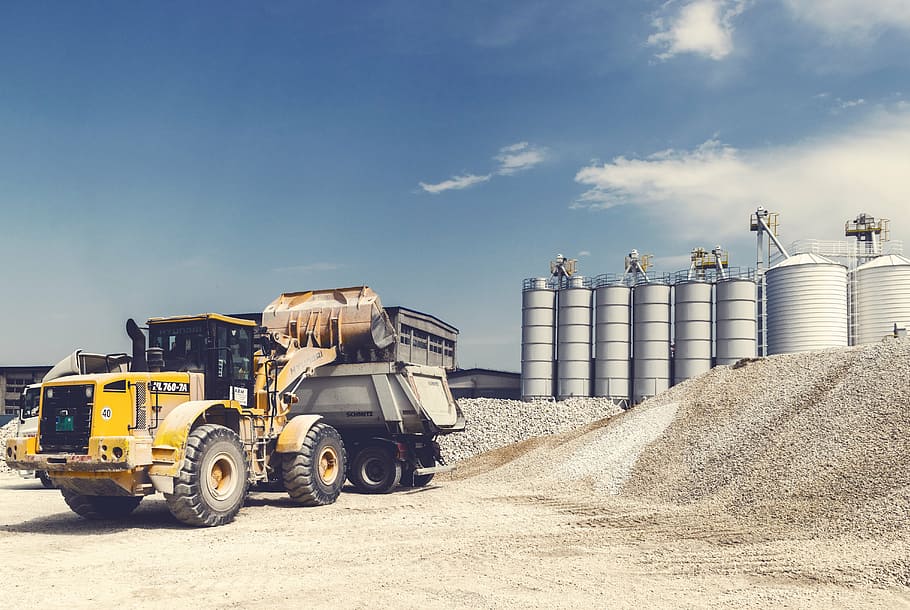 yellow, black, tractor, clouds, daytime, equipment, gravel, heavy, heavy equipment, industrial area