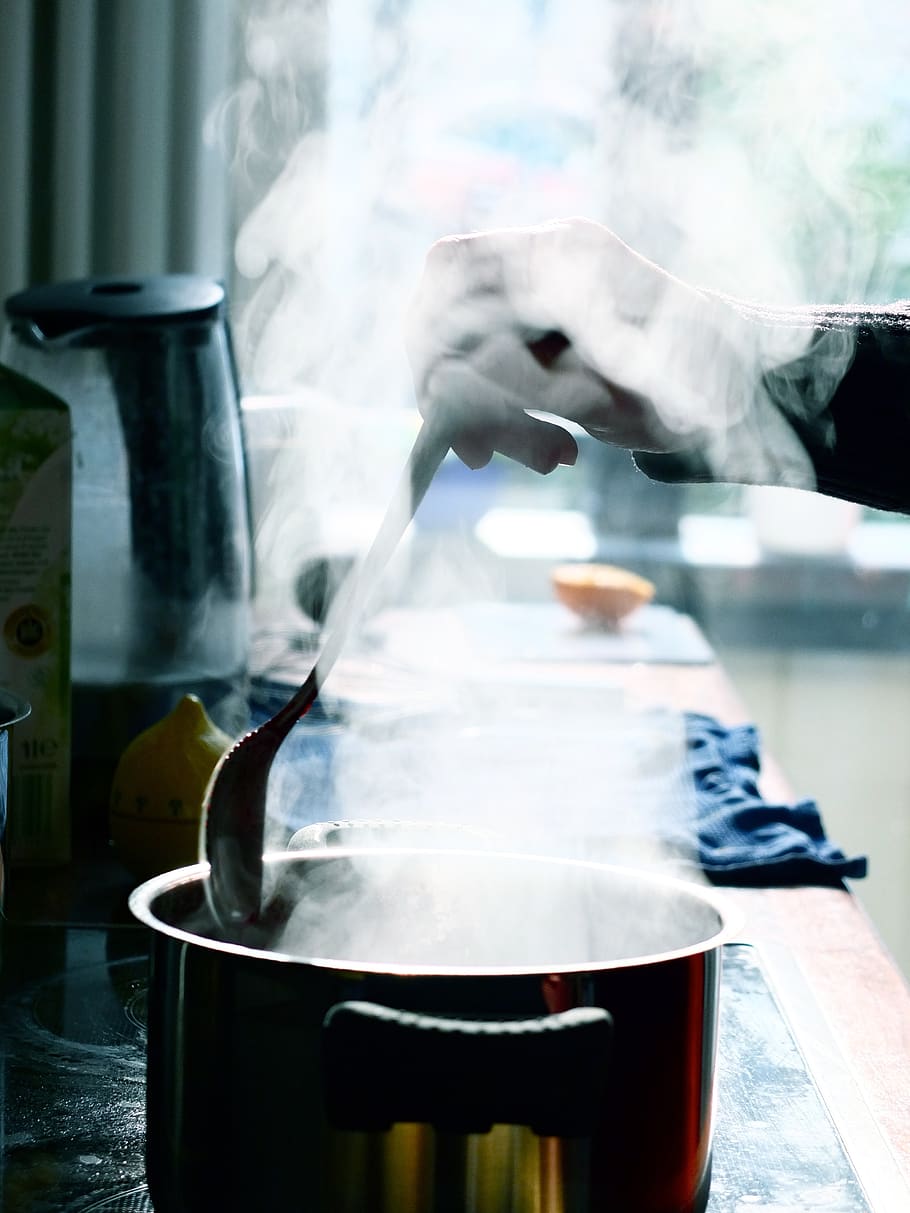 pot, kitchen, steam, smoke, spoon, stir, cook, human hand, indoors, real people