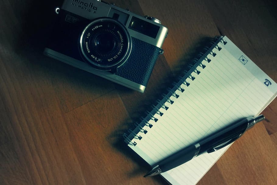 flat, lay, photography, grey, black, minolta milc camera, lined, notebook, retractable, pen