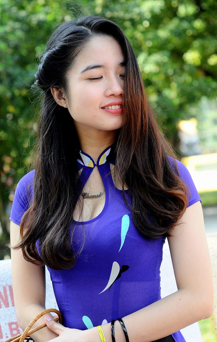woman, blue, cap-sleeved, top, standing, trees, white shirt, vietnam, girl, young
