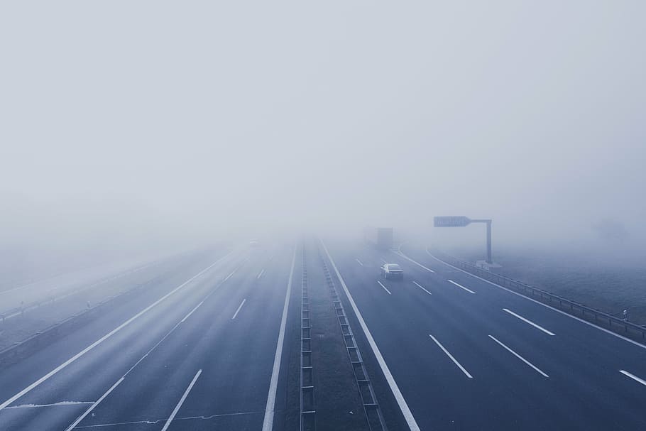 fog-covered highway, daytime, freeway, fog, vehicle, road, way, lane, car, path
