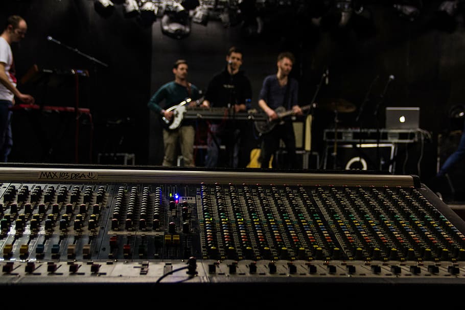 three, men, standing, playing, instruments, occur, band, mixing console, sound, sound engineer