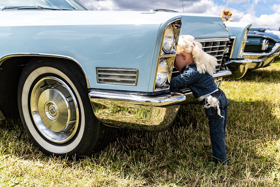 car, blonde, doll, mechanic, woman, photoshoot, coverall, dispute, mode of transportation, motor vehicle
