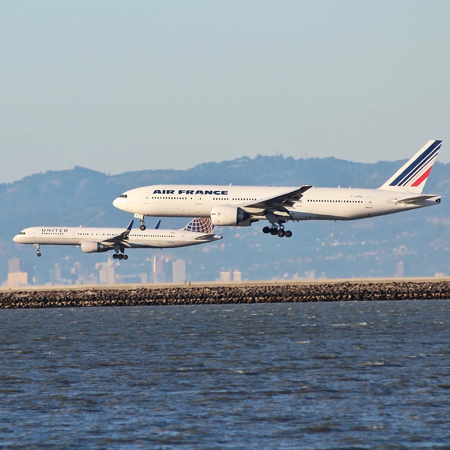 air france airliner, flying, another, water, daytime, aircraft, airplane, plane, flight, transportation