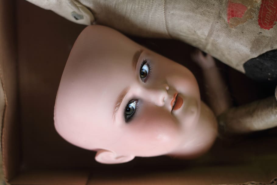 doll head, box, mask, baby, eyes, face, lips, nose, eyebrows, toy