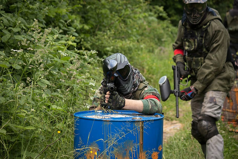 two, person, using, paintball markers, paintball, game, wood, plant, two people, adult