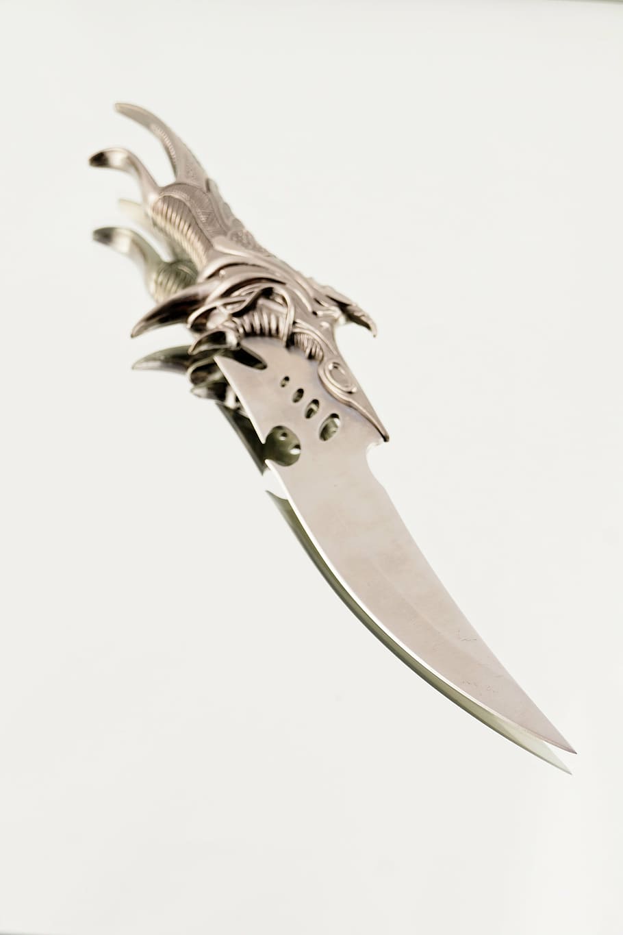 silver-colored dagger, handle, ornament, weapon, knife, fight, white background, indoors, studio shot, copy space