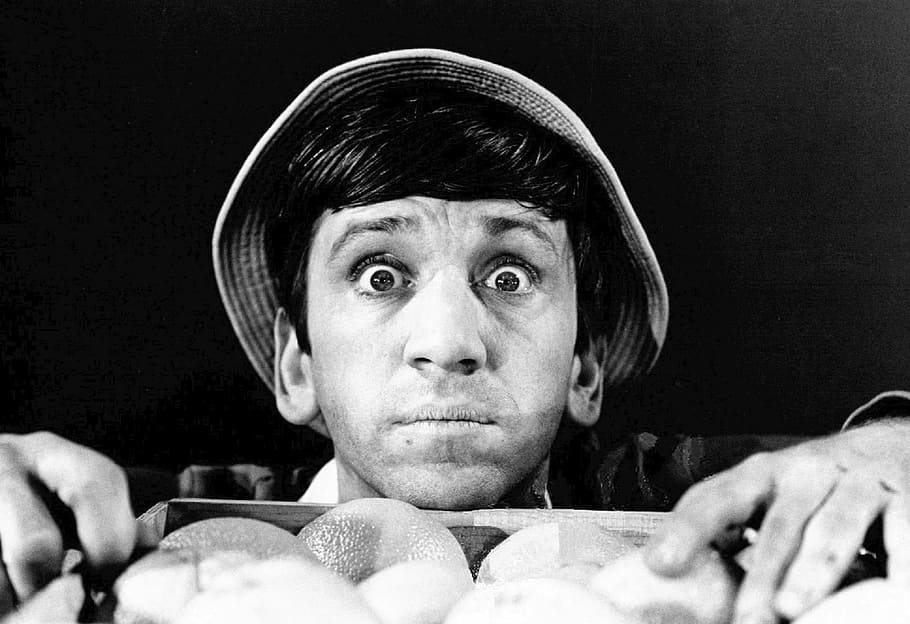 grayscale photo, man, wearing, hat, holding, fruit, bob denver, actor, comedy, television