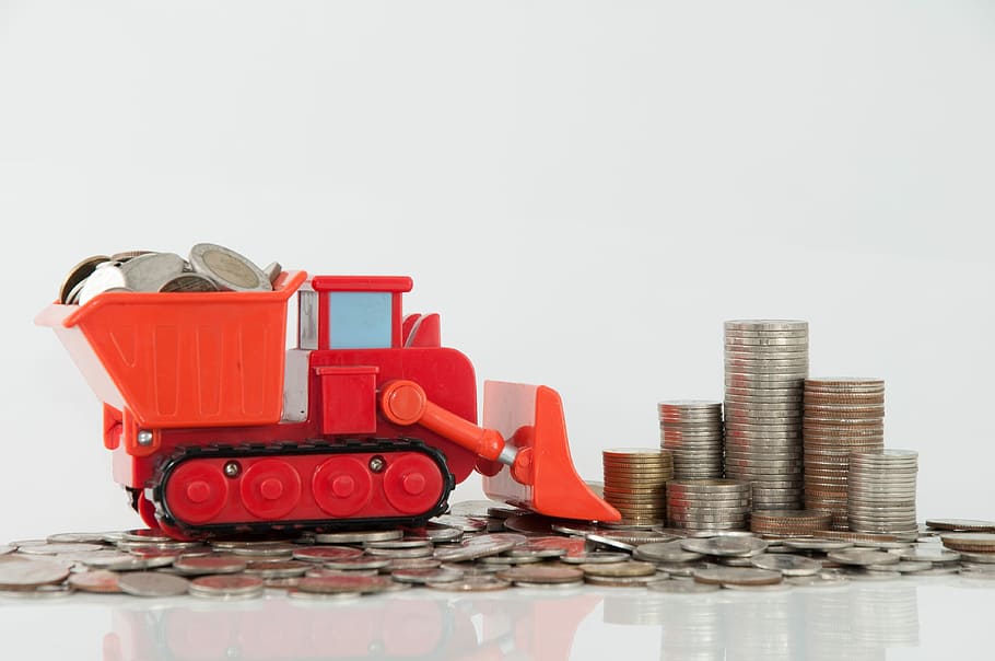 red frontloader toy, Money, Coin, Truck, sea, white background, studio shot, skyscraper, sky, finance