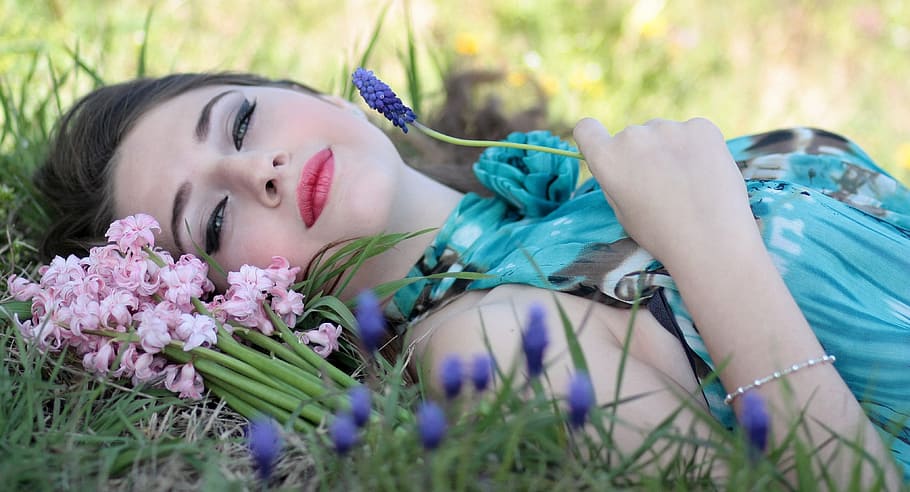 woman, lying, grass field, holding, grape hyacinth flowers, girl, flowers, spring, blue eyes, beauty