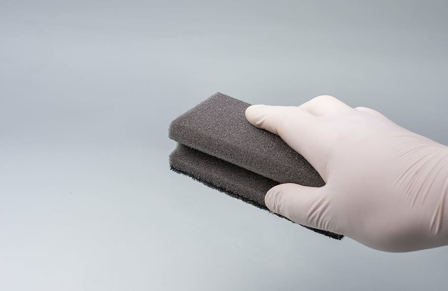 person, wearing, white, glove, holding, black, brick, hand, clean, sponge