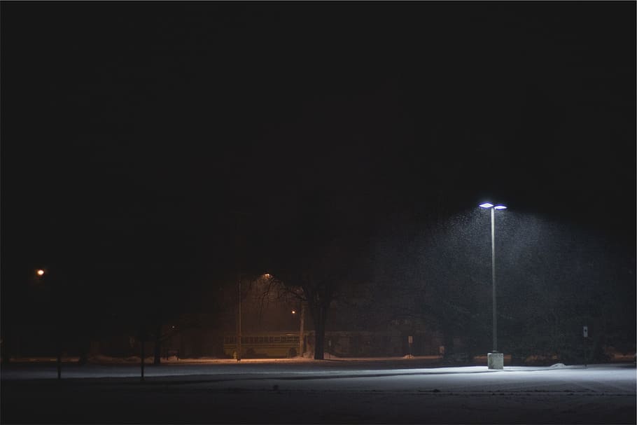 turned-on, outdoor, post lamp, street, parking lot, snow, lamp post, light, dark, night