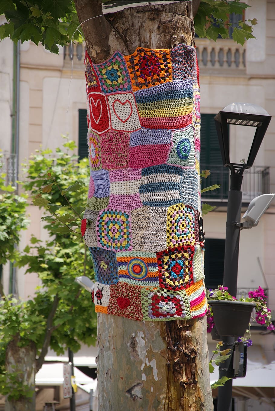 tree, guerrilla crochet, mallorca, crochet, beautification, hand labor, crafted nature, multi colored, focus on foreground, day