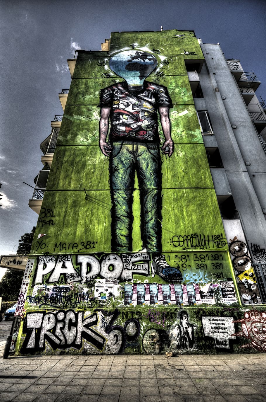 graffiti, mural, spray paint, building, wall, architecture, urban, high rise, text, human representation