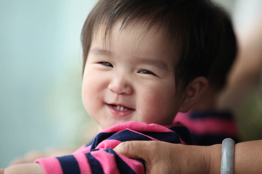 macro shot, smiling, baby boy, wearing, black, blue, stripe shirt, black and blue, stripe, shirt