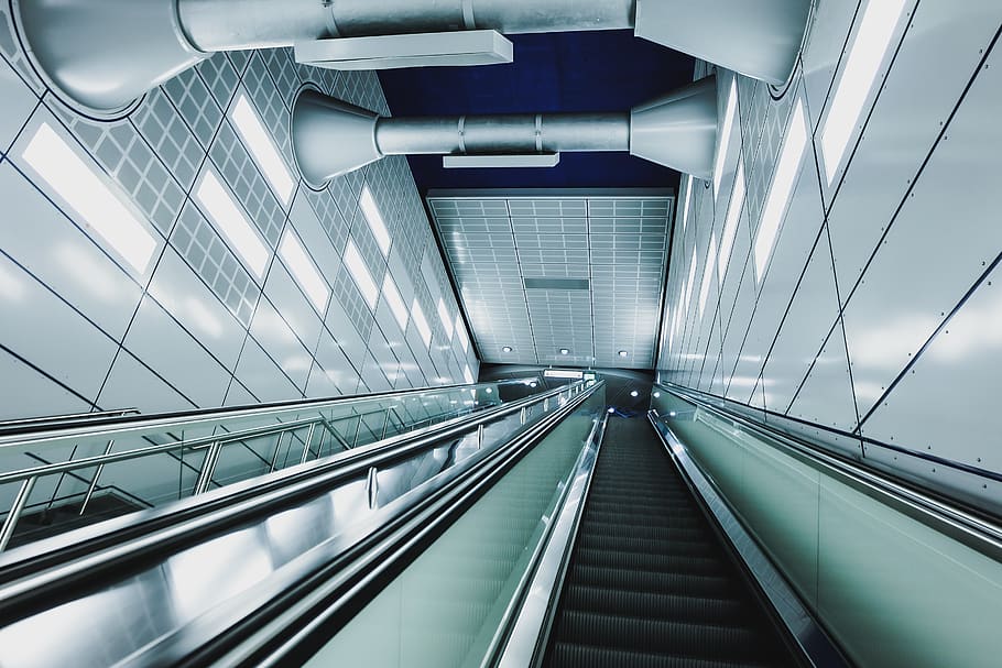 architecture, building, infrastructure, escalator, lights, wall, railing, transportation, built structure, direction