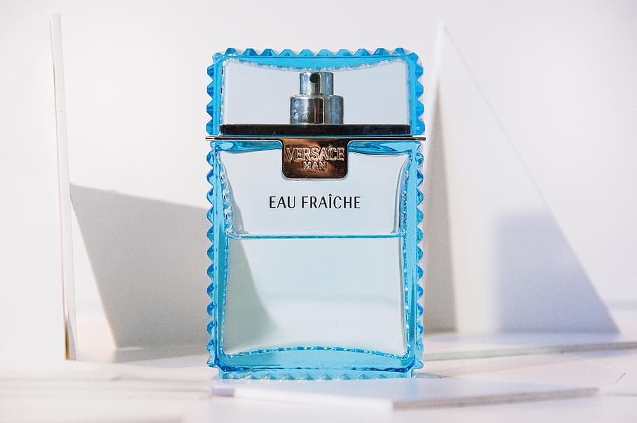 perfume, eau de cologne, glass, text, western script, blue, indoors, white background, studio shot, white color
